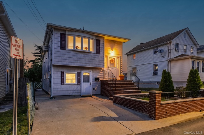 View of front of home featuring a fenced front yard
