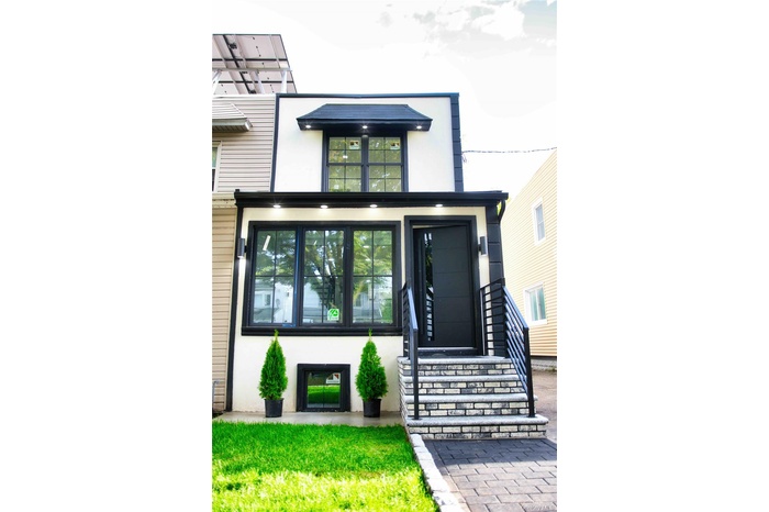 Property entrance featuring stucco siding