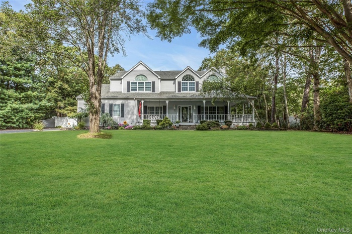 Country-style home featuring covered porch