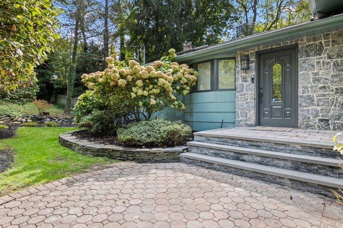 Entrance to property featuring a chimney
