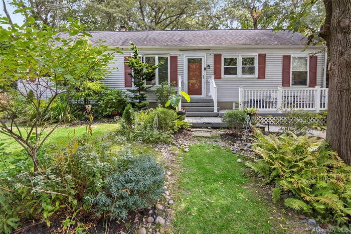 View of front of home featuring a shingled roof