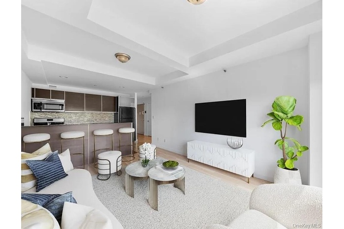 Living room featuring light wood-style flooring