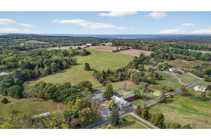View of property location with rural landscape and a large body of water