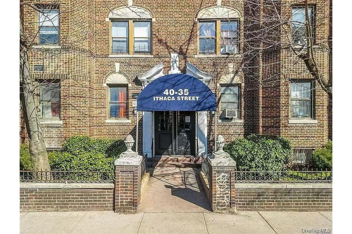 Property entrance featuring brick siding