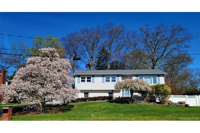 Split foyer home featuring brick siding