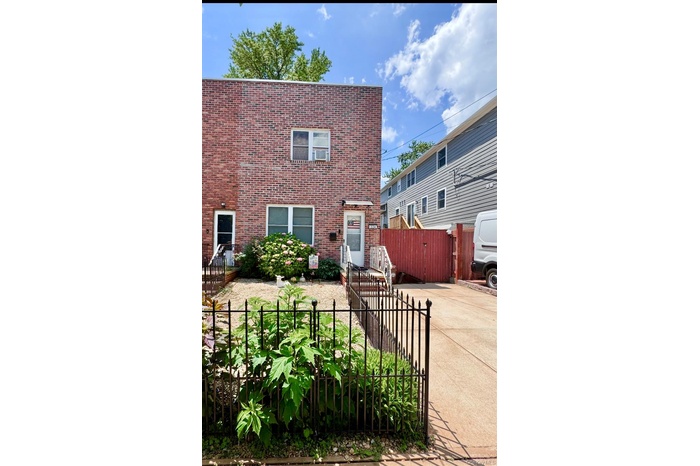 View of front of house featuring brick siding