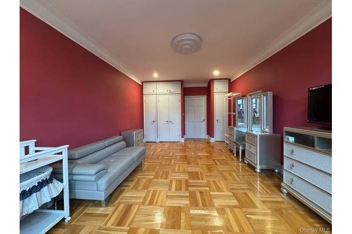 Sitting room featuring ornamental molding