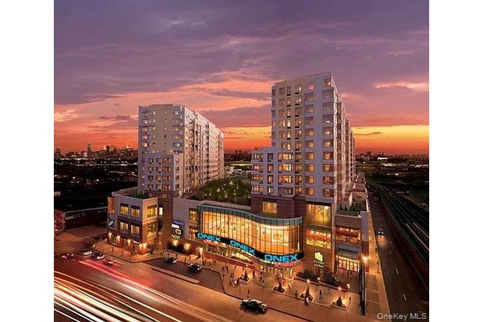 Property at dusk featuring a view of city