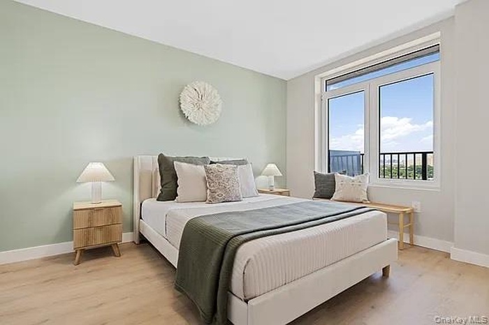 Bedroom with light wood-style floors