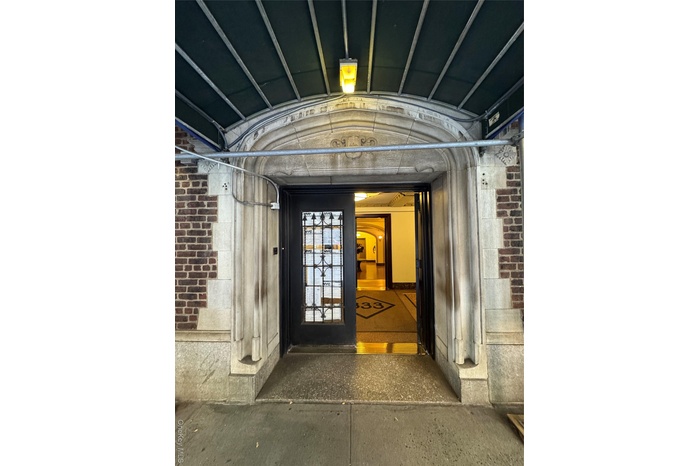 Entrance to property with brick siding