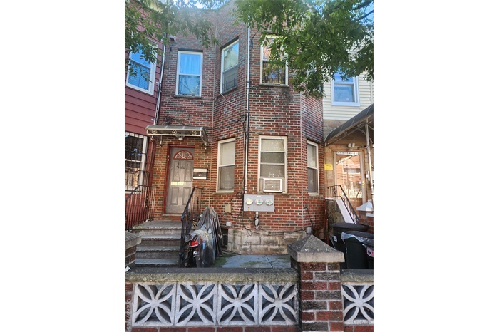 View of front of house with brick siding
