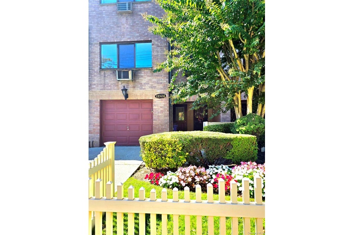 View of exterior entry featuring brick siding