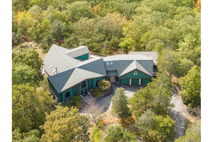 View from above of property featuring a forest