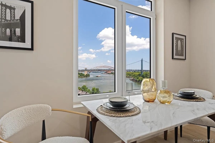 Dining area featuring a water view and wood finished floors