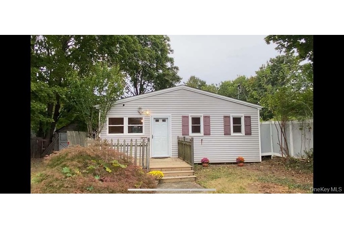 View of front of house with a deck