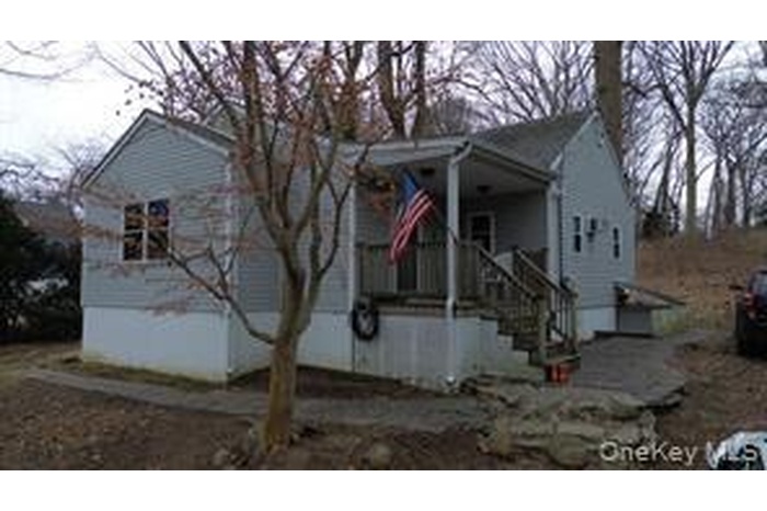 View of front of house with covered porch