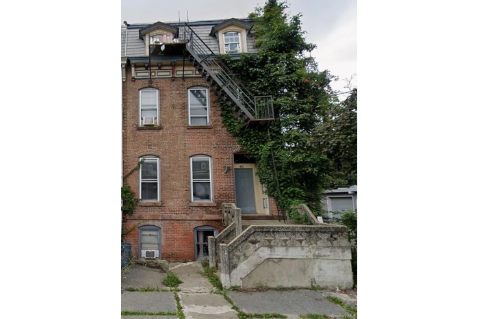 View of front of house with brick siding