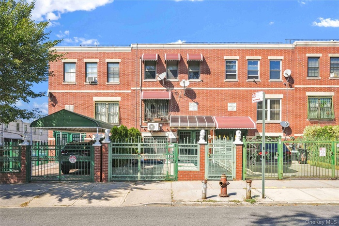 View of property with a fenced front yard