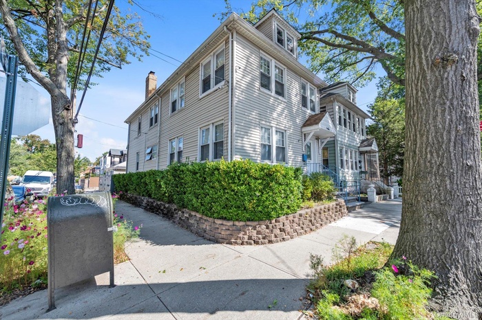View of side of property with a chimney