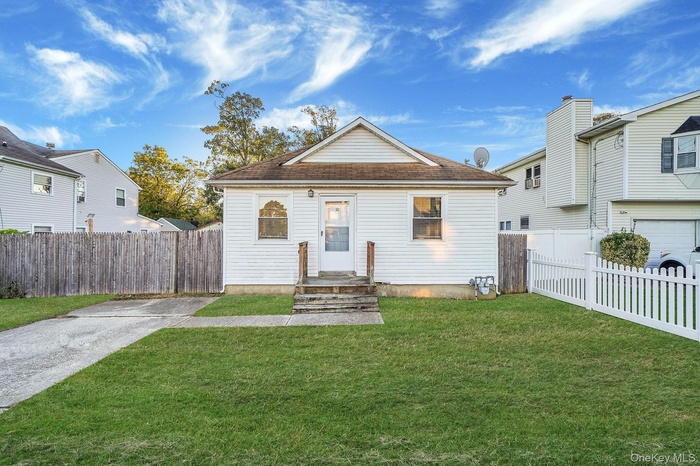Bungalow-style house featuring a shingled roof