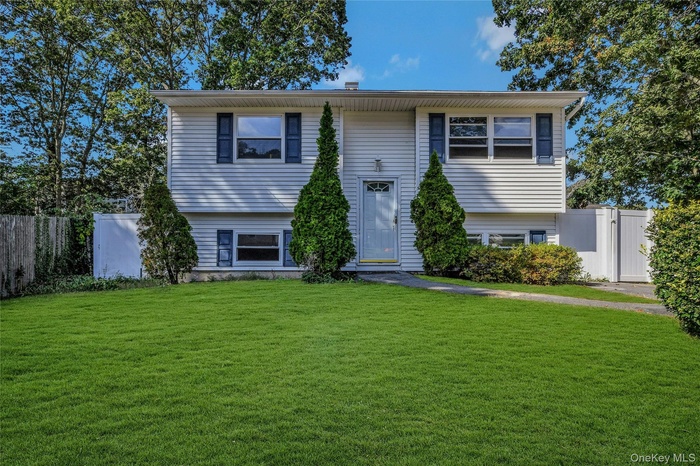Split foyer home featuring a gate