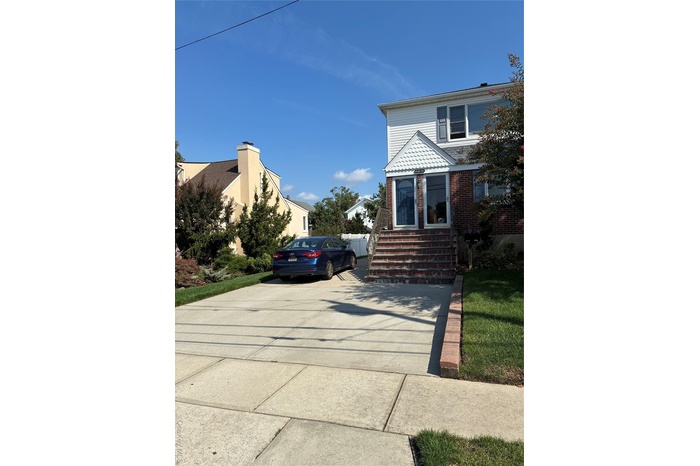 View of front of property with brick siding
