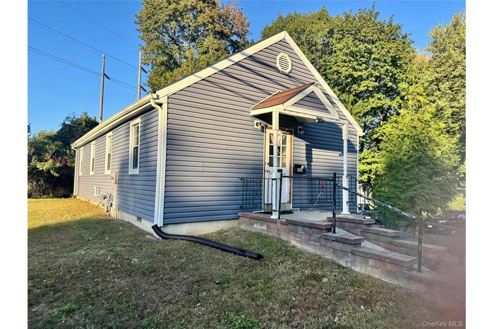 View of front of property with a front lawn