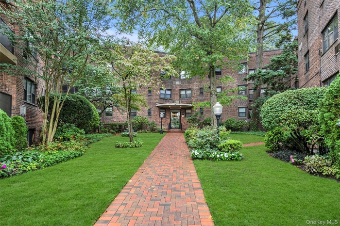 View of home's community featuring a yard