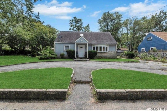 View of front of house featuring stone siding