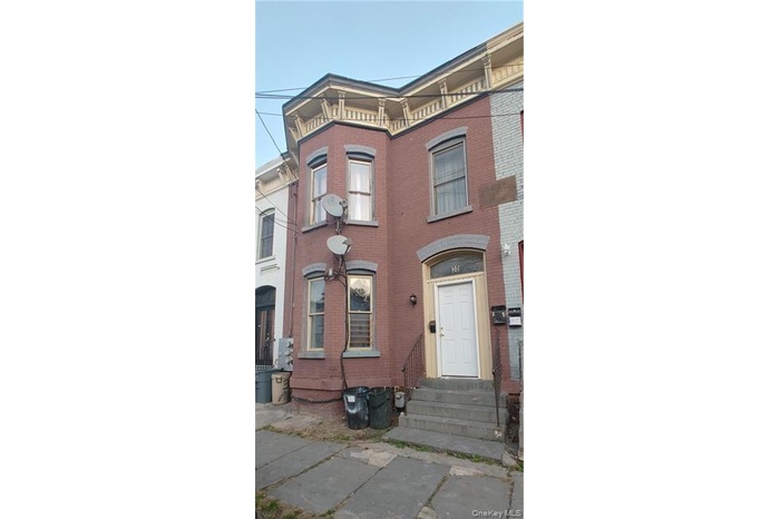 Italianate home with brick siding and entry steps