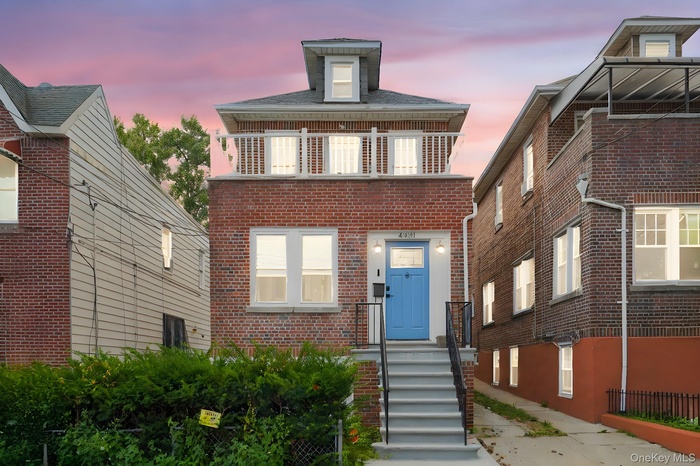 View of front of house with brick siding