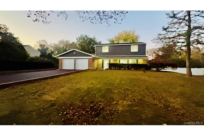 View of front of property featuring driveway