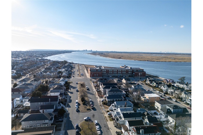 Aerial view featuring a residential view and a water view