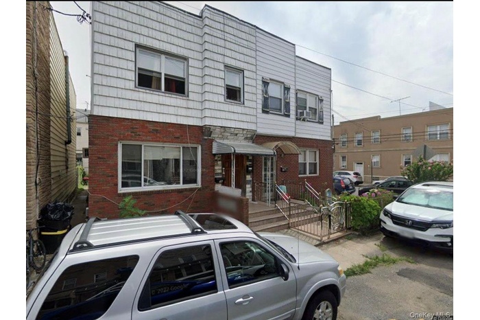 View of front facade featuring brick siding