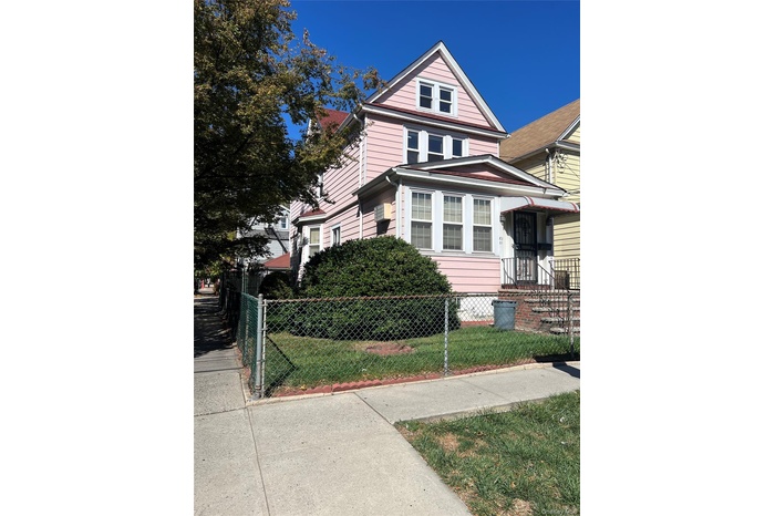 View of home's exterior with a fenced front yard