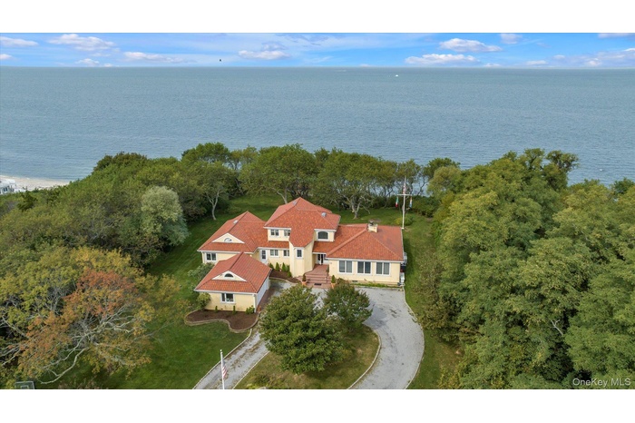View from above of property with a nearby body of water