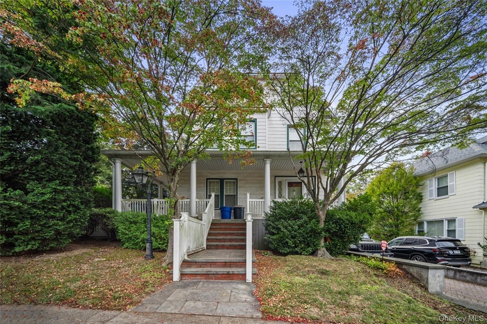View of front of house with covered porch