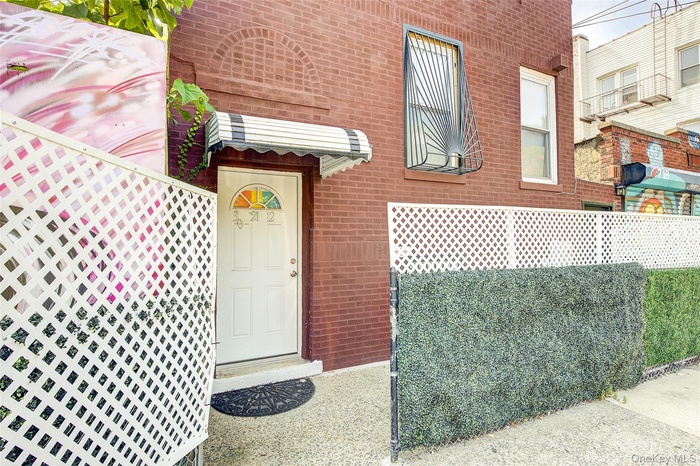 Property entrance with brick siding