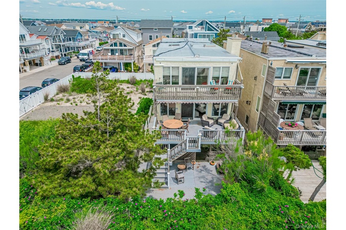 Rear view of house featuring a residential view
