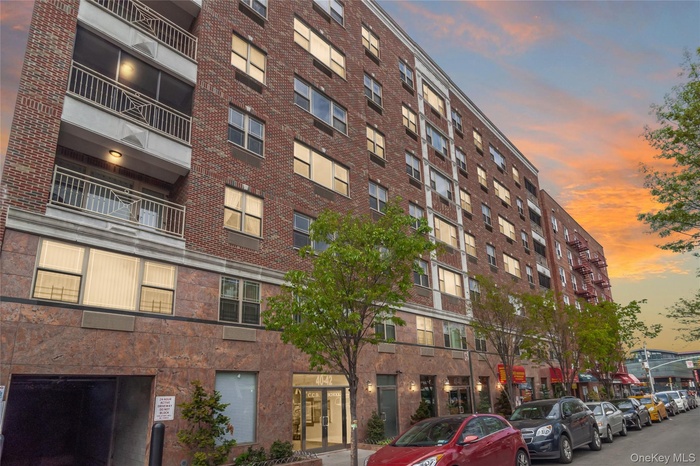 Property at dusk with a view of apartment building / complex