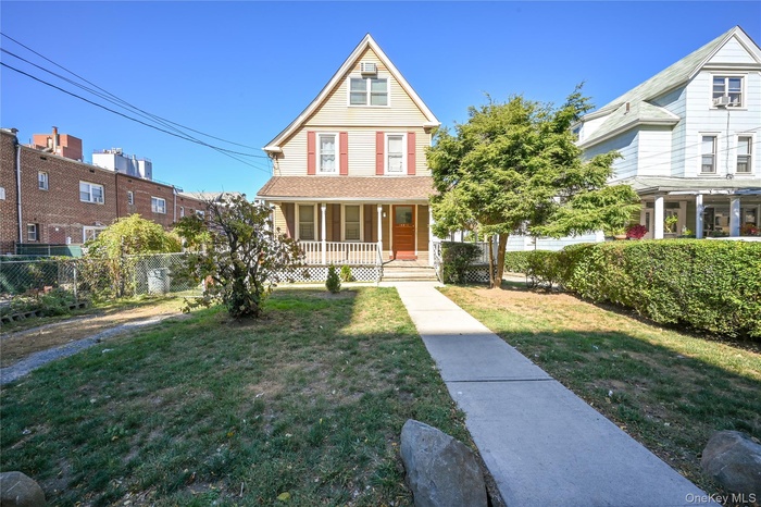 Victorian home featuring covered porch