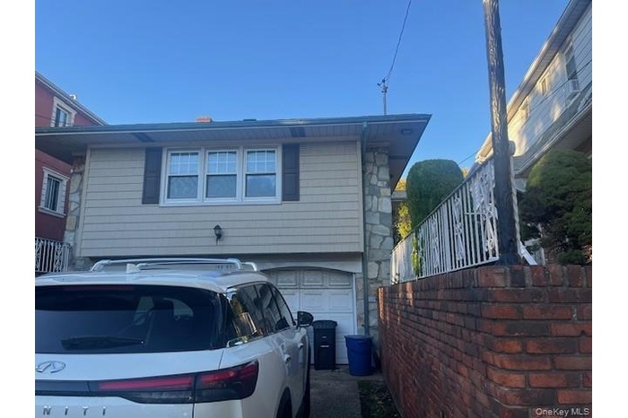 View of side of property with an attached garage