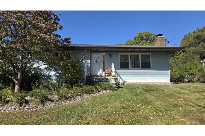 View of front of house with a front lawn