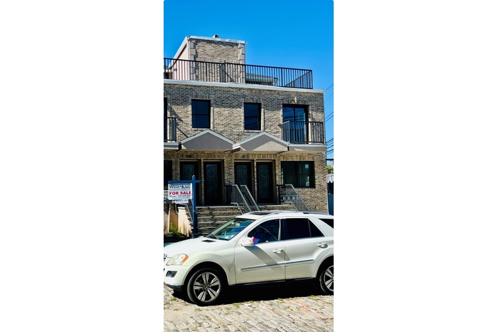 View of front of house with brick siding