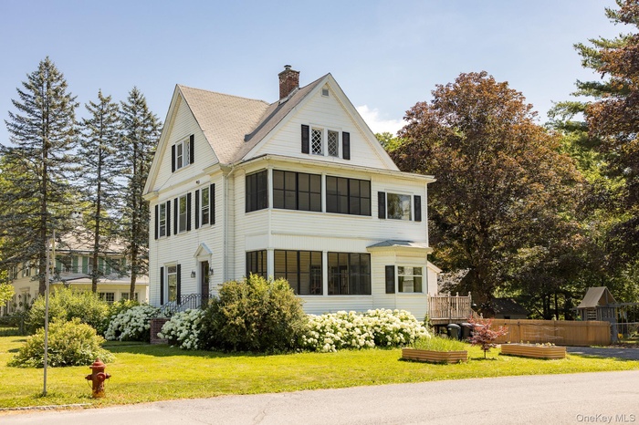 View of property exterior with a chimney