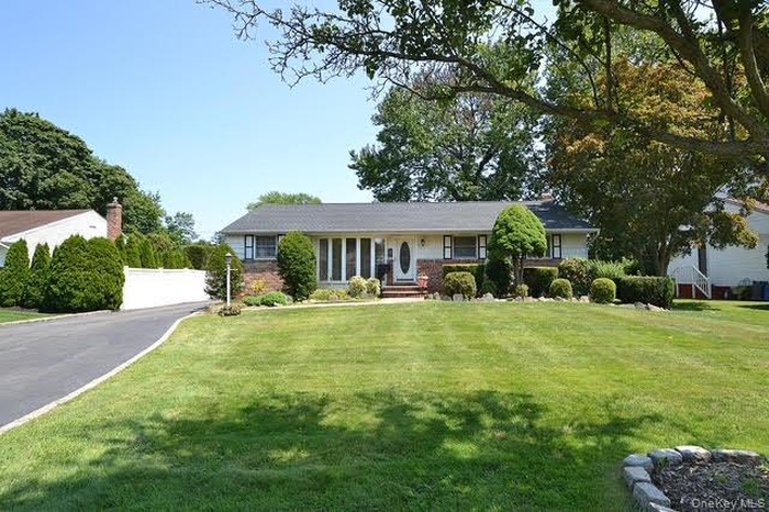 Front view of house - features large driveway