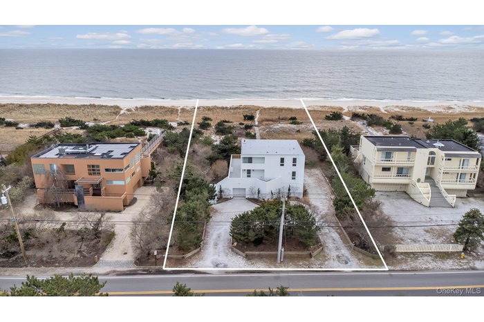 Drone / aerial view with a water view and a view of the beach
