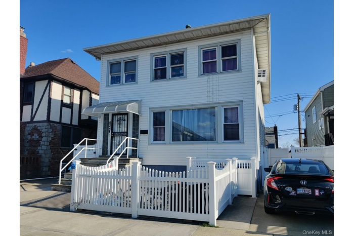 View of front facade with a fenced front yard