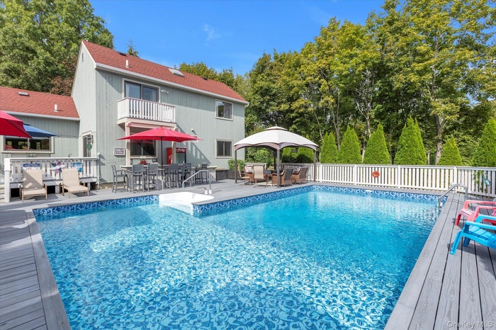 View of pool and home. Lots of room for entertaining!