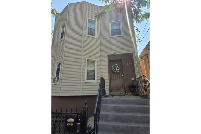 View of front of property featuring cooling unit